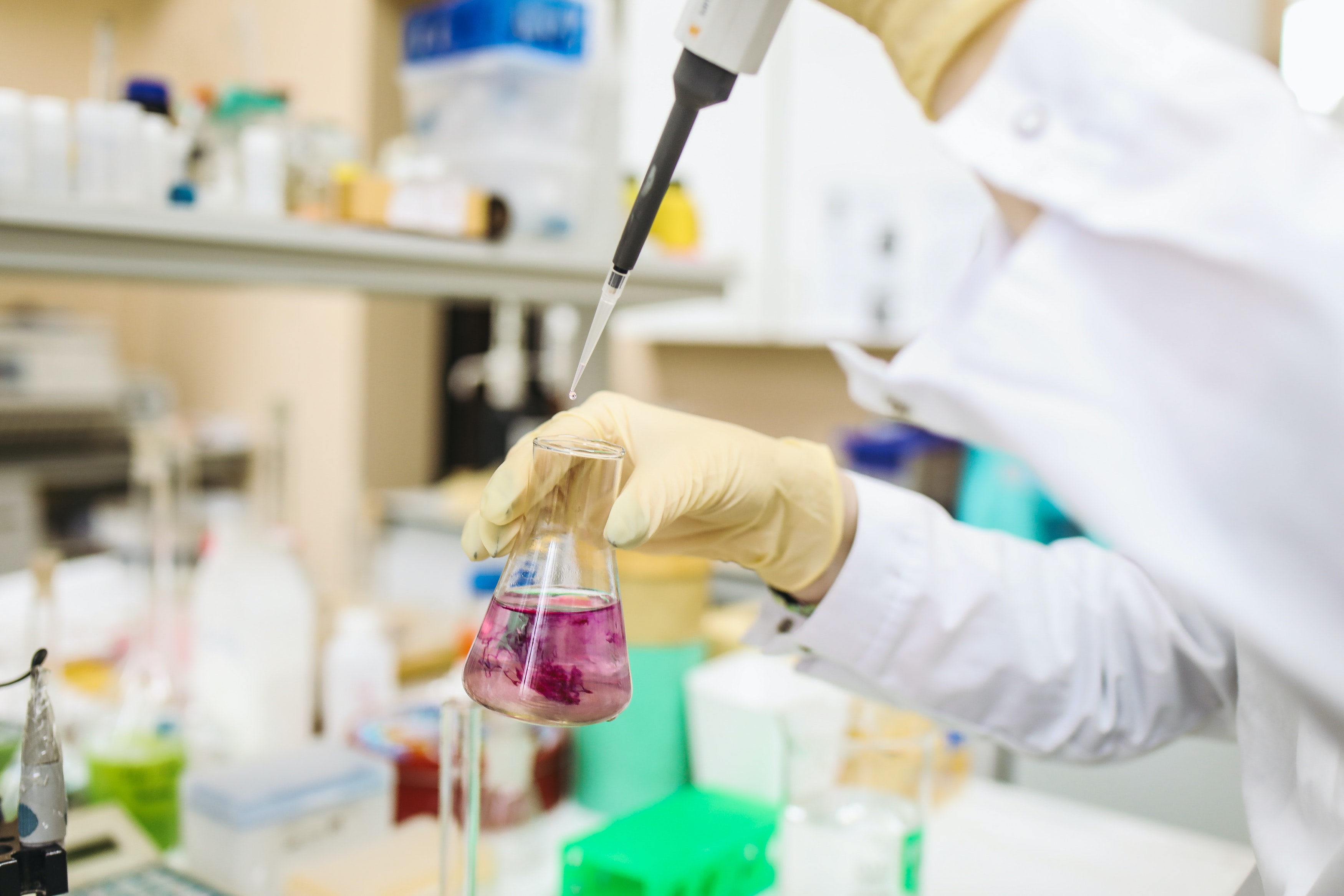 Scientists using pipette