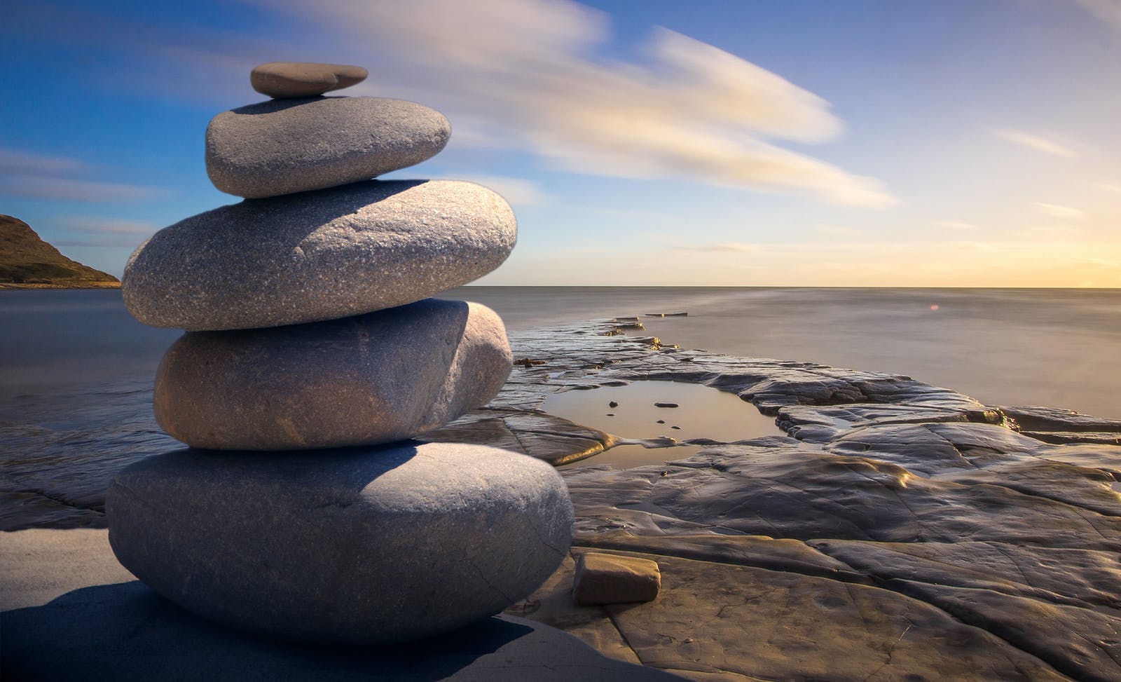 Stack of rocks balancing near ocean