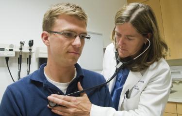 Doctor with patient in clinic